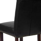 Silla de comedor Parson tapizada con respaldo enrollado, ribete de tachuelas y estructura con acabado y deslizadores de plástico para el suelo